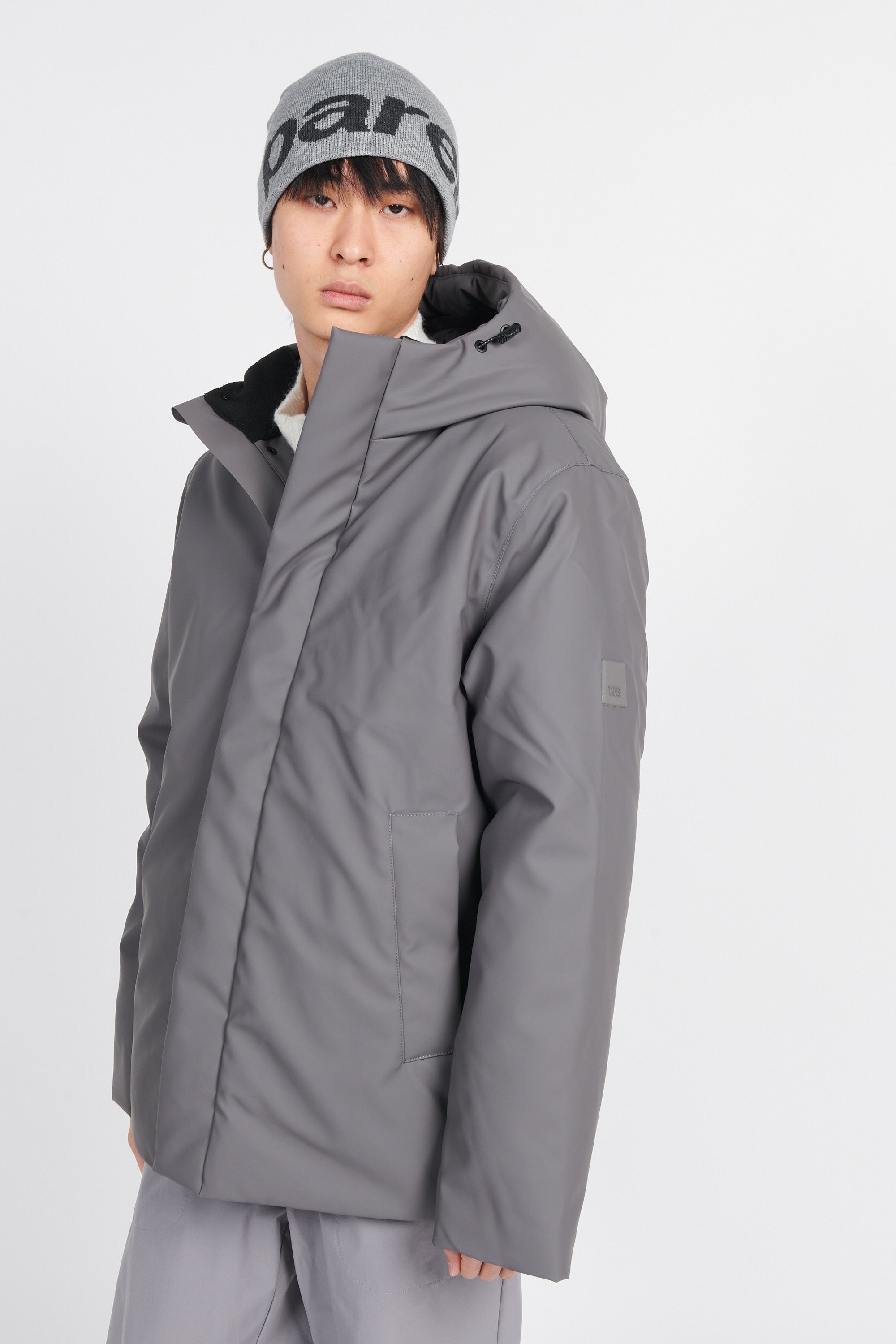 Lightweight quilted padded jacket with high neck | Grey by RAINS Lightweight quilted padded jacket with high neck Grey