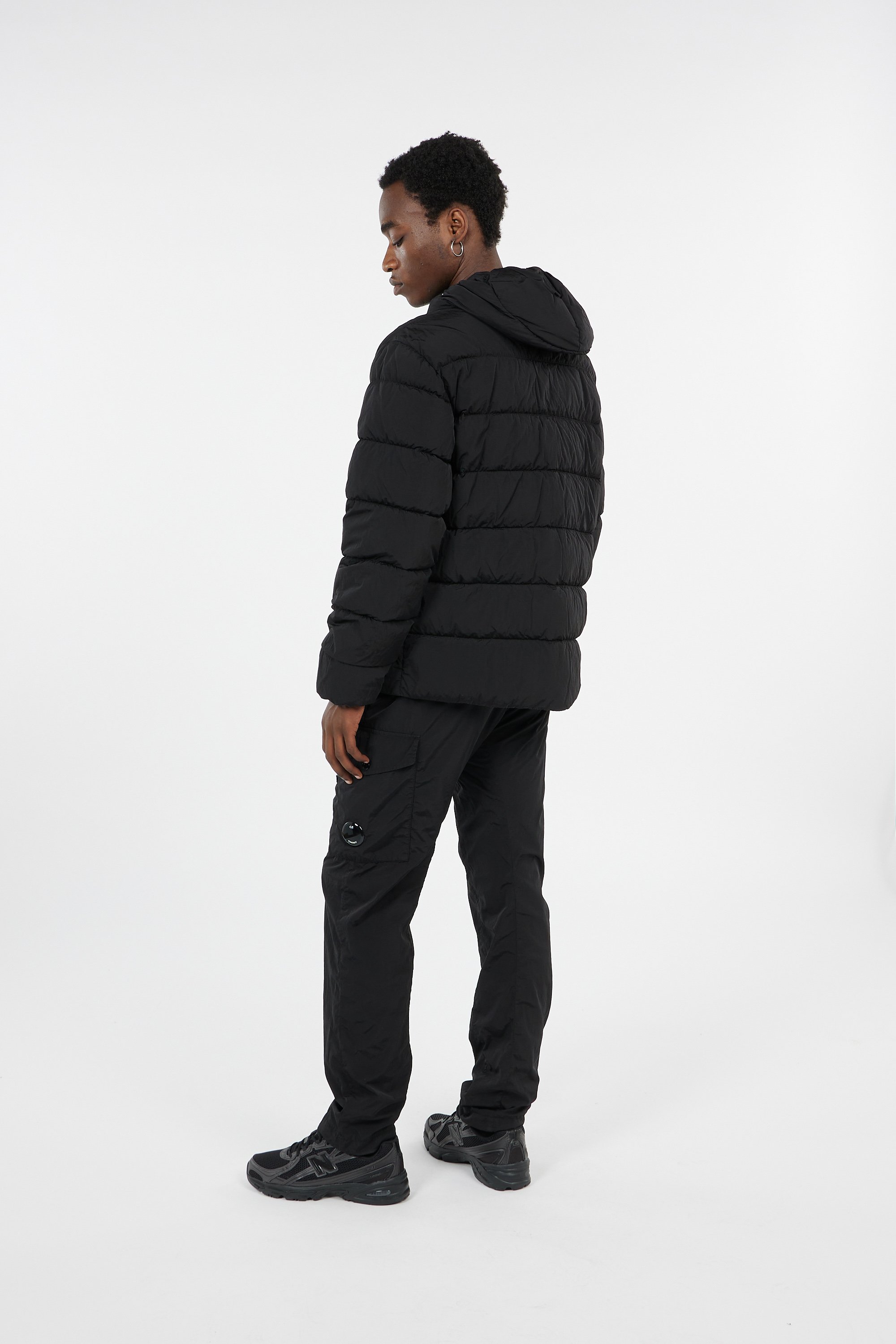 Lightweight quilted padded jacket with high neck | Black by C.P. COMPANY Lightweight quilted padded jacket with high neck Black
