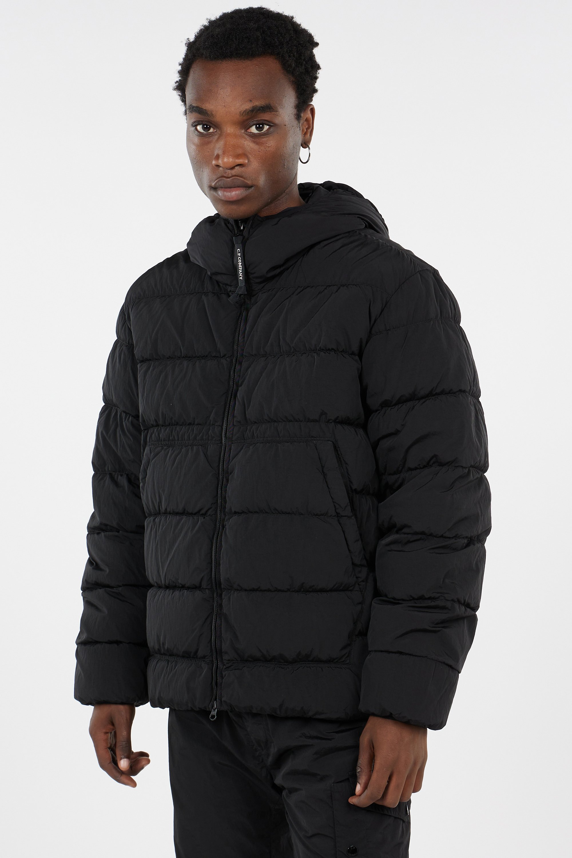 Lightweight quilted padded jacket with high neck | Black by C.P. COMPANY Lightweight quilted padded jacket with high neck Black